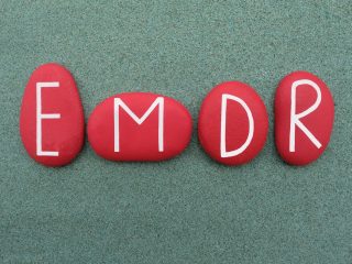 EMDR, Eye Movement Desensitization and Reprocessing, red stone letters logo EMDR, Eye Movement Desensitization and Reprocessing, red stone letters logo